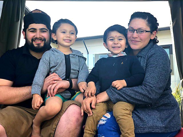 Stephanie and her family smile at the camera