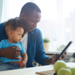 A parent and child using a tablet