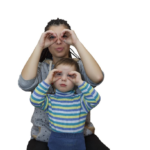 A mother and child pretend their hands are binoculars